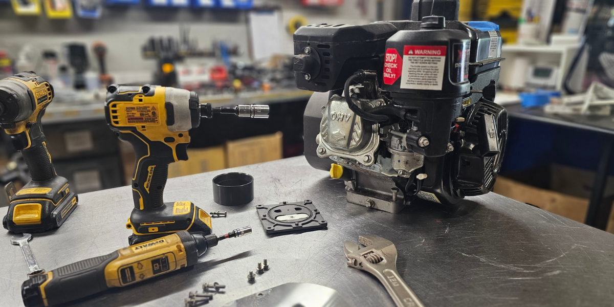 Brownie’s-third-lung-system-service Annual maintenance of a Brownie's dive system engine on a workbench with tools scattered around, showcasing the meticulous care and servicing process.