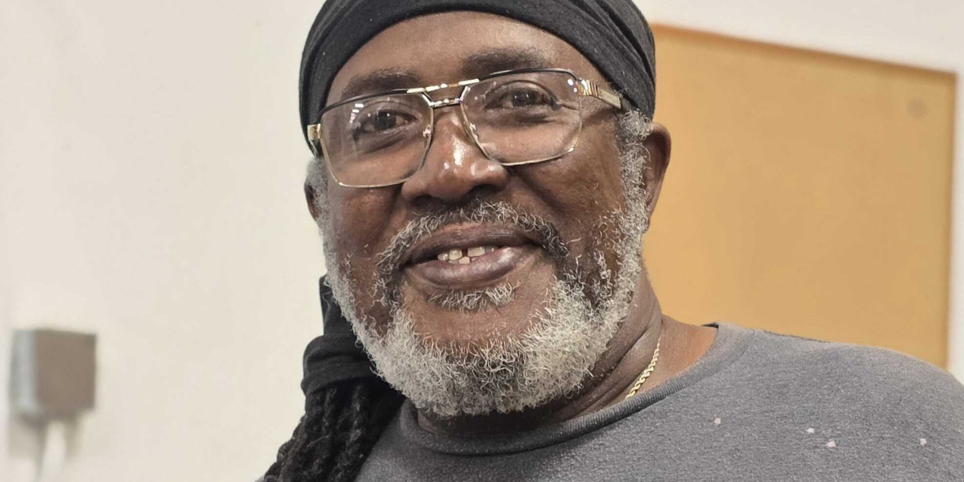 Claude, Shipping Specialist at Brownie's THIRD LUNG, smiling and wearing Brownie's branded attire.